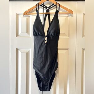 One piece swimsuit with lace up back & adjustable straps. Brand new with tags.